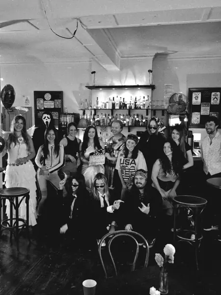 Cast and crew group photo at the pub bar